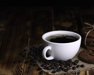 white-cup-americano-coffee-with-chocolate-chip-cookie-Top